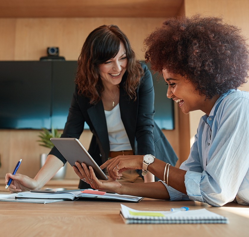 business-workers-at-table-smiling