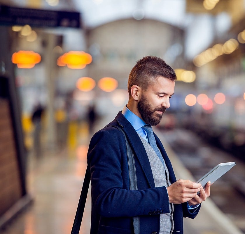 man outside on tablet