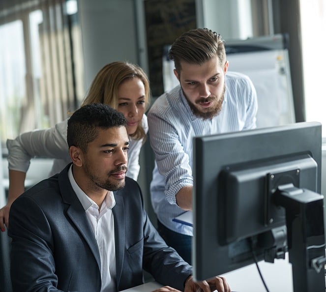 business-workers-around-computer