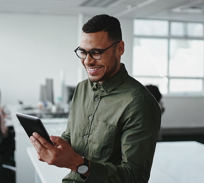 man-using-tablet-in-office